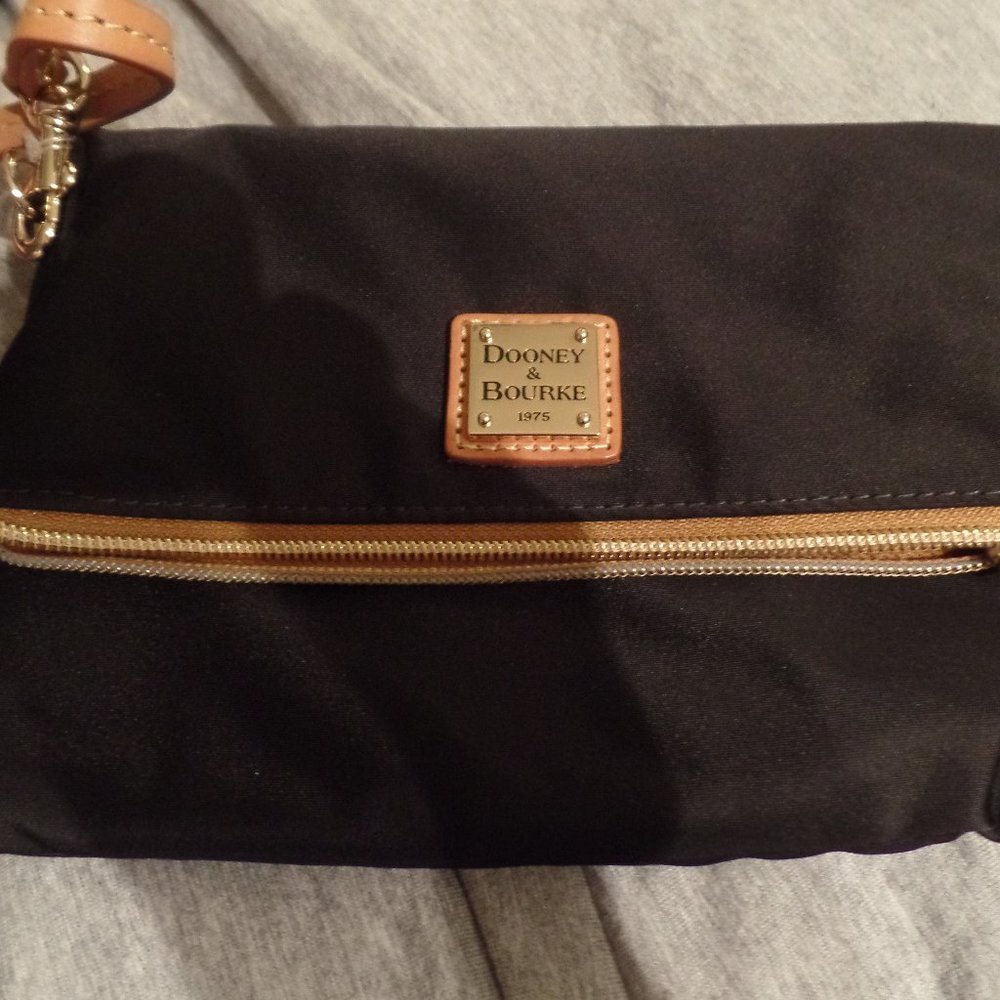 Small black nylon Dooney & Bourke crossover purse with red inside